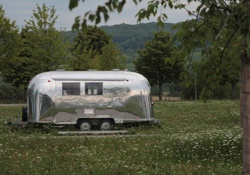 An aluminum-framed travel trailer.
