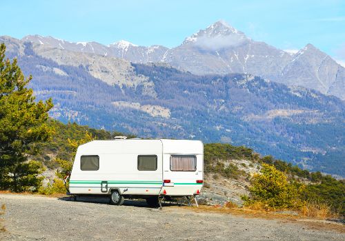 A camper van parked high in the mountains