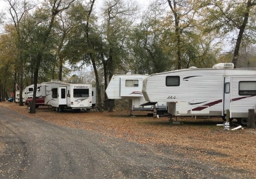 A few fifth-wheel trailers in a campground