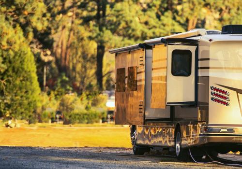 A hybrid trailer with sleeping spaces outside of the RV’s frame