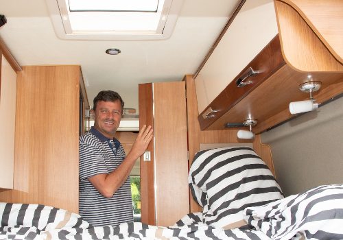 A man checking a camper for renting