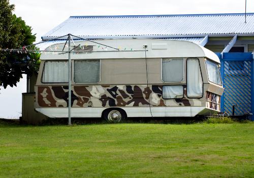 An RV parked in the backyard