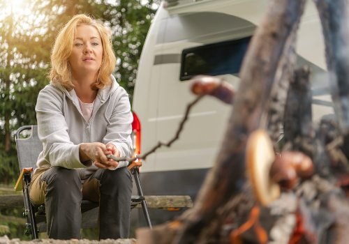 Woman grilling food while RVing