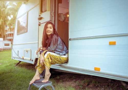 A woman sitting in a renting RV
