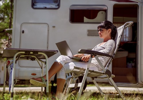 A woman using internet on an RV holiday trip